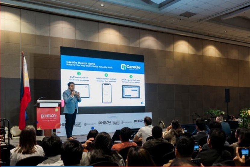 Founder presenting a live product demo on The Showcase stage